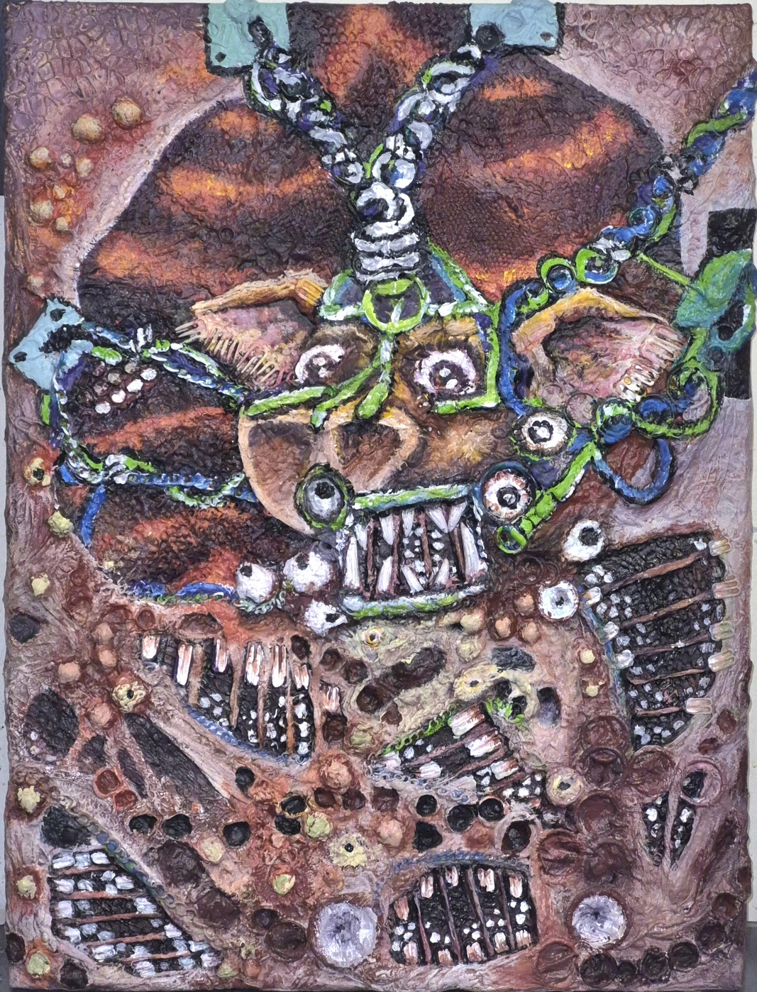 Textured pink and brown anatomical forms, bulging eyes and many tooth-filled mouths crossed by blue and acid-green straps, chains and bows.